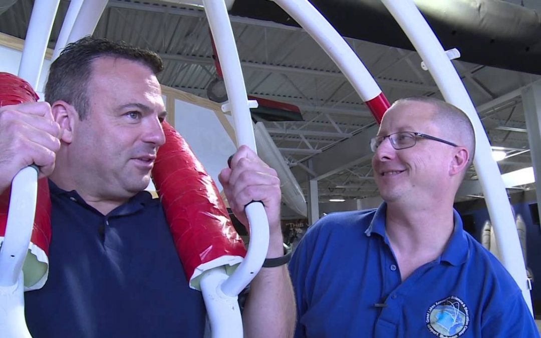 Eric tests out the shuttle simulator at Spaceport Sheboygan | Discover Wisconsin