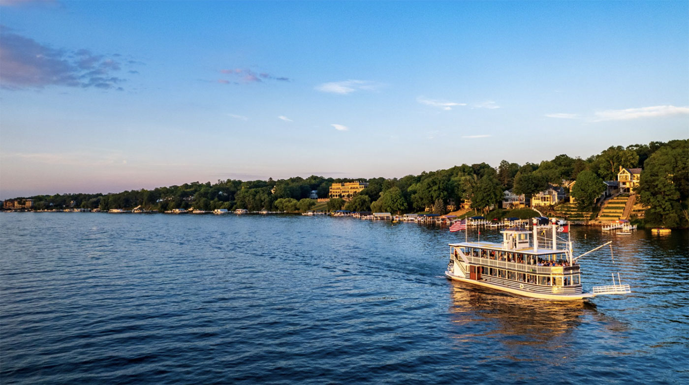 lake geneva shoreline with vintage tour boat